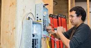 A guy working on an electrical